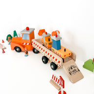 wooden toy trucks with the verse "faith can move mountains" printed on the ramp.