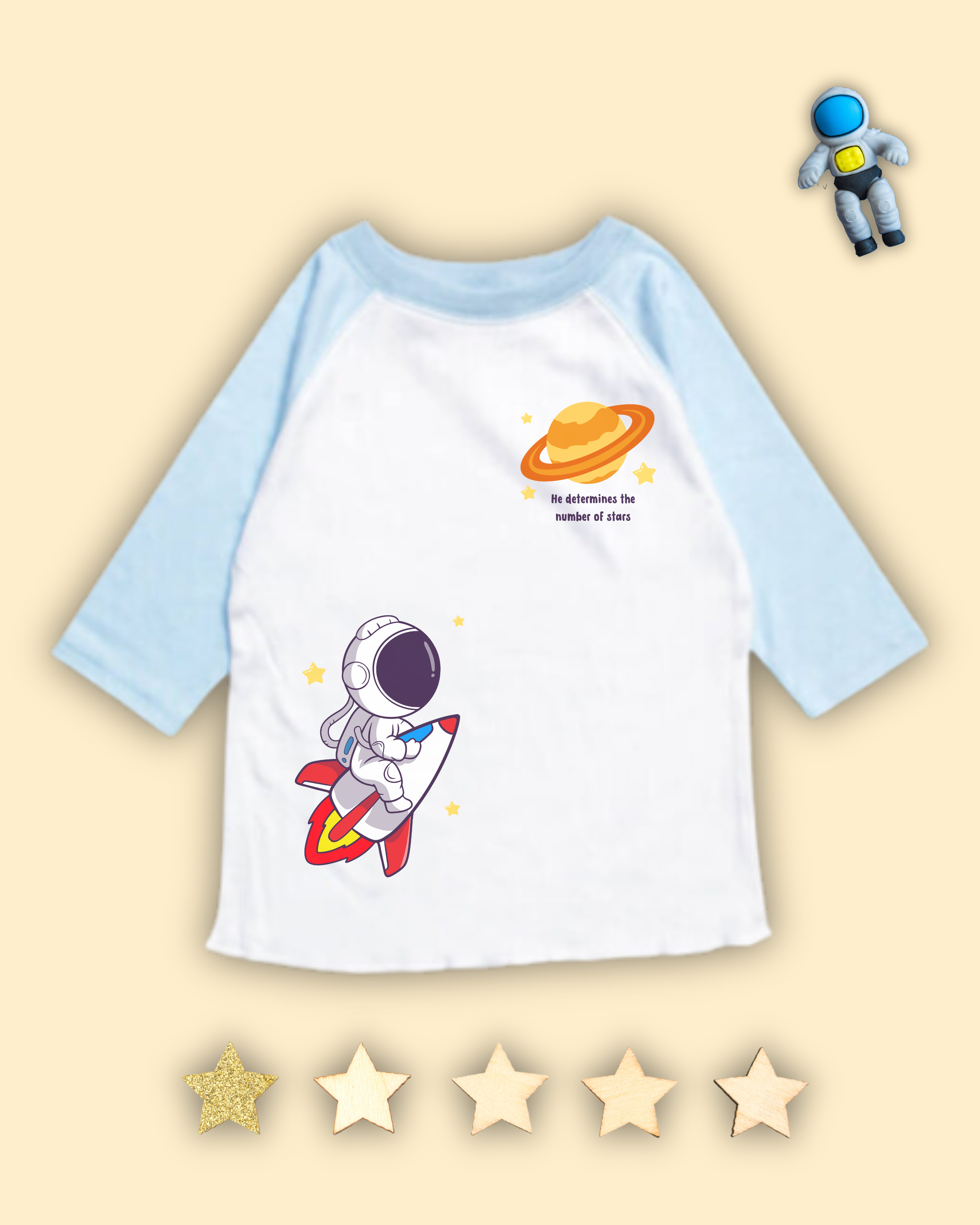 Light Blue and white raglan tshirt for kids that has an astronaut, rocketship, planet, stars and bible verse from Psalm 147