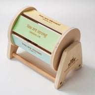 Wooden spinning baby drum features an affirmation bible verse.